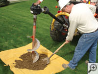 Auguring a hole in the earth for a foundation repair in West St Paul