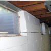 A foundation showing severe inward buckling along the windows in a The Pas home.
