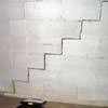 A diagonal stair step crack along the foundation wall of a Mitchell home