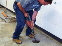 Coring the concrete of a concrete slab floor in West St Paul