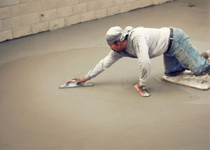 smoothing out the grout in a slab releveling project in Thompson