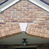Major tuckpointing on a home archway over a door, with tuckpointing several inches wide that has failed on a Winnipeg home