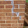 Tuckpointing that cracked due to foundation settlement of a Brandon home