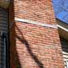 A tilting chimney on a Grosse Isle home with a leaning, tilting chimney that was temporarily repaired.