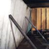 Temporary foundation wall supports stabilizing a Dauphin home