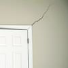A long drywall crack beginning at the corner of a doorway in a Oakbank home.
