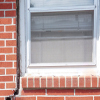 A gap in a window along the outer wall due to foundation settlement of a Springfield home.