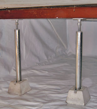Crawl space jack posts installed in conjunction with a crawl space vapor barrier in Grande Pointe