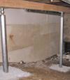 A system of crawl space support posts adding structural support to a crawl space in St Adolphe