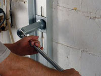 Mounting a foundation wall channel anchor in Thompson.
