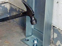 Mounting a foundation channel anchor installation to the floor in Thompson.