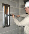 Tightening a wall anchor plate in Dauphin, Manitoba
