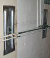 Foundation wall anchor plates installed in a basement in Portage La Prairie