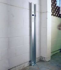 A failing foundation wall repaired with a foundation wall channel anchor system in a Dauphin home.