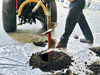 Digging the hole used for wall anchor installation in Headingley.